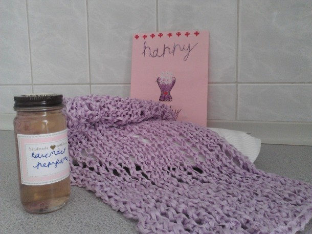 A gift from the heart - a handmade card, homemade lavender water, and a knitted scarf